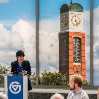 President Philomena Mantella at podium speaking at event